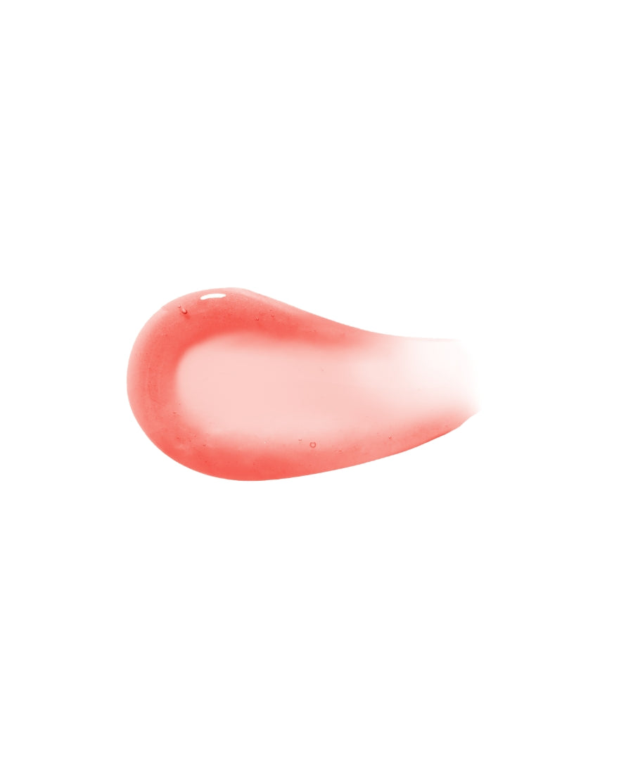 A smooth, glossy swatch of Legendary Lip Oil in a soft pink hue showcasing its nourishing, clean beauty formulation with natural and organic ingredients.