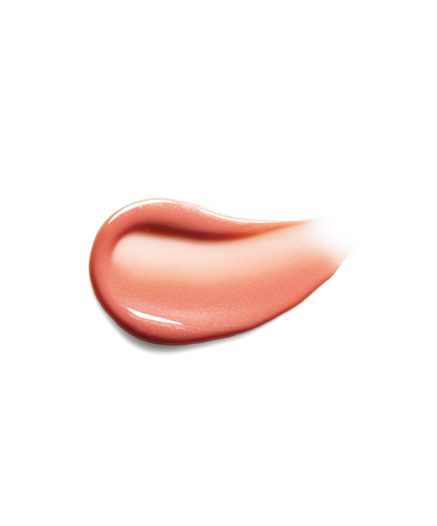 Smooth peachy-pink swatch of Legendary Lip Oil showcasing its glossy, nourishing texture with clean beauty and natural ingredients for hydrated lips.