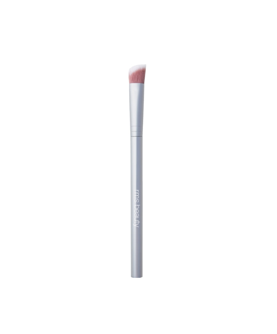 Skin2Skin Concealer Brush with soft angled bristles and sleek silver handle designed for precise application of makeup, featuring clean beauty and sustainable packaging elements.