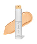ReEvolve Natural Finish Liquid Foundation by RMS Beauty in a sleek white bottle with beige foundation swatch background, featuring clean beauty and natural ingredients.