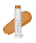 ReEvolve Natural Finish Liquid Foundation bottle by RMS Beauty with a warm medium shade swatch behind, featuring clean beauty, cruelty free makeup, and sustainable packaging.