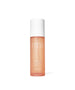 A sleek bottle of Radiance Lock Setting Mist with a translucent peach hue, white cap, and minimalist design, reflecting clean beauty and natural skincare.
