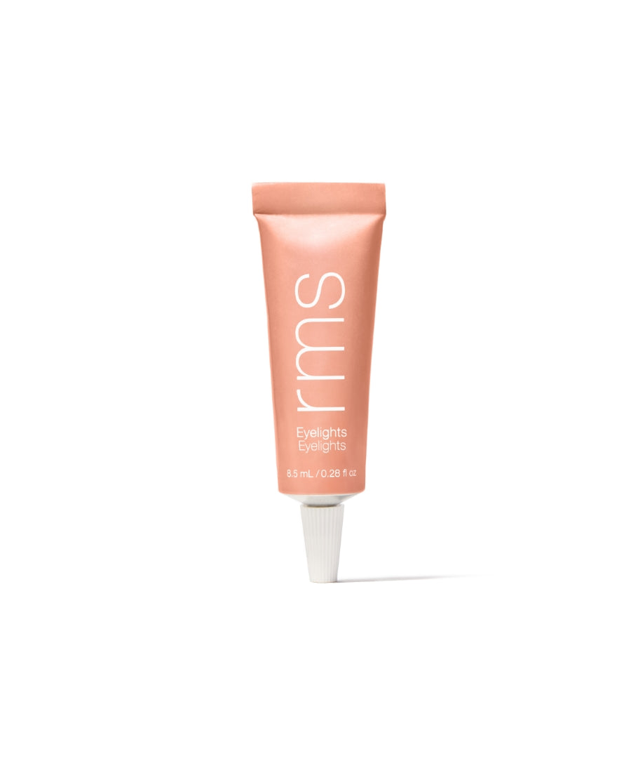 Tube of Eyelights Cream Eyeshadow in a soft peach shade with clean beauty formulation, cruelty-free makeup, and sustainable packaging by rms beauty.