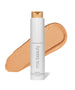 ReEvolve Natural Finish Liquid Foundation by RMS Beauty in a pump bottle with a smooth beige foundation swatch, showcasing clean beauty and natural ingredients for a flawless complexion.