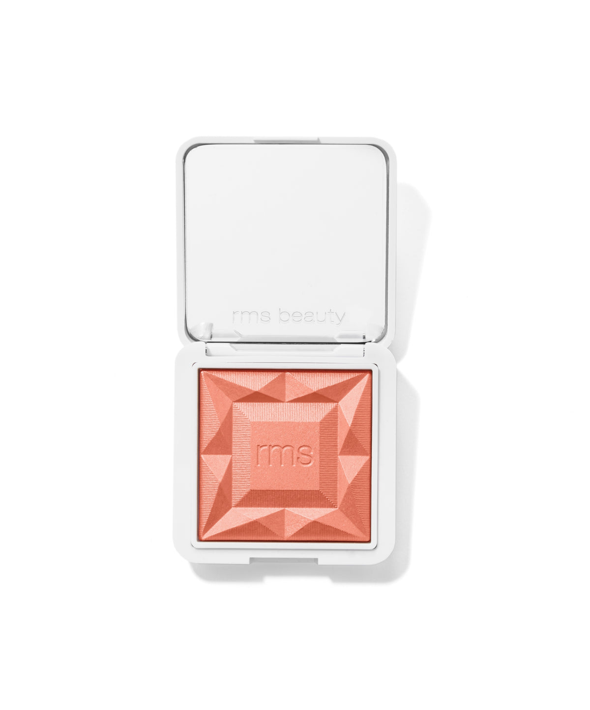 Compact square container with a peach-toned textured powder blush embossed with "rms," representing ReDimension Hydra Powder Blush, known for clean beauty and skincare-infused makeup.