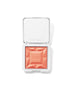 Open compact showing orange coral ReDimension Hydra Powder Blush with geometric embossed design by RMS Beauty, cruelty free makeup with clean ingredients and sustainable packaging.