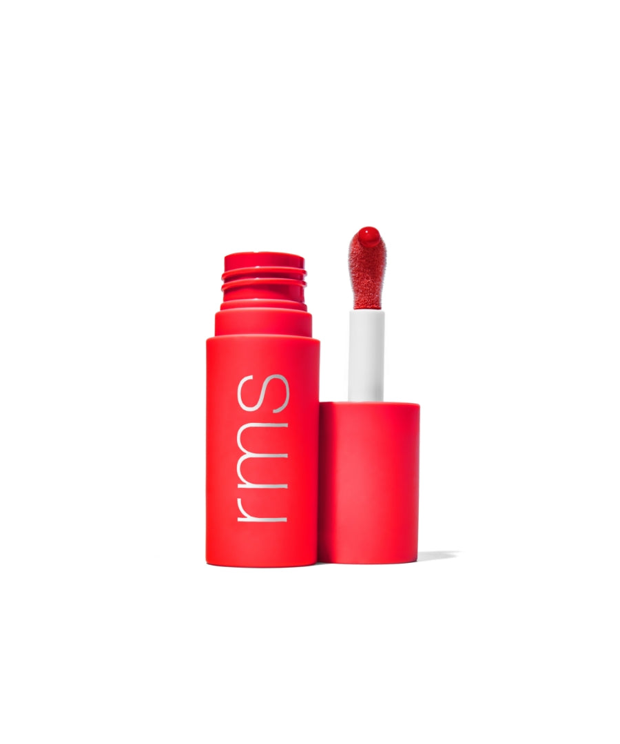 Open red RMS Beauty container with a lip applicator showing glossy red Legendary Lip Oil, featuring clean beauty and natural ingredients.