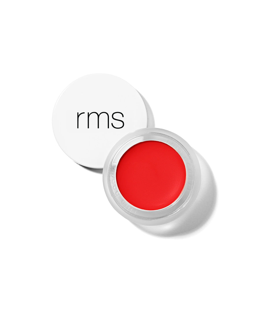 Open container of vibrant red Lip2Cheek cream makeup by RMS Beauty with white lid, showcasing a smooth texture and clean beauty, natural ingredients formulation.