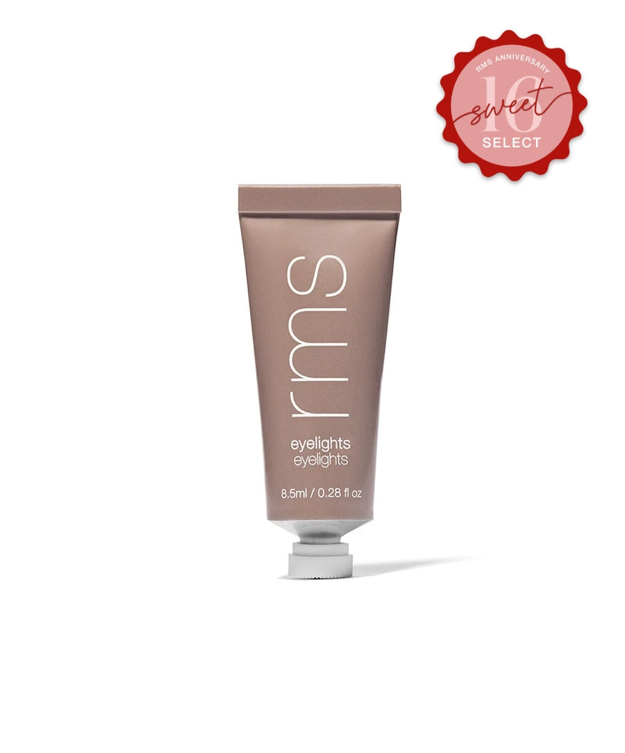 Tube of Eyelights Cream Eyeshadow in a neutral taupe shade with minimalist packaging, featuring clean beauty and natural ingredients for radiant eye makeup.