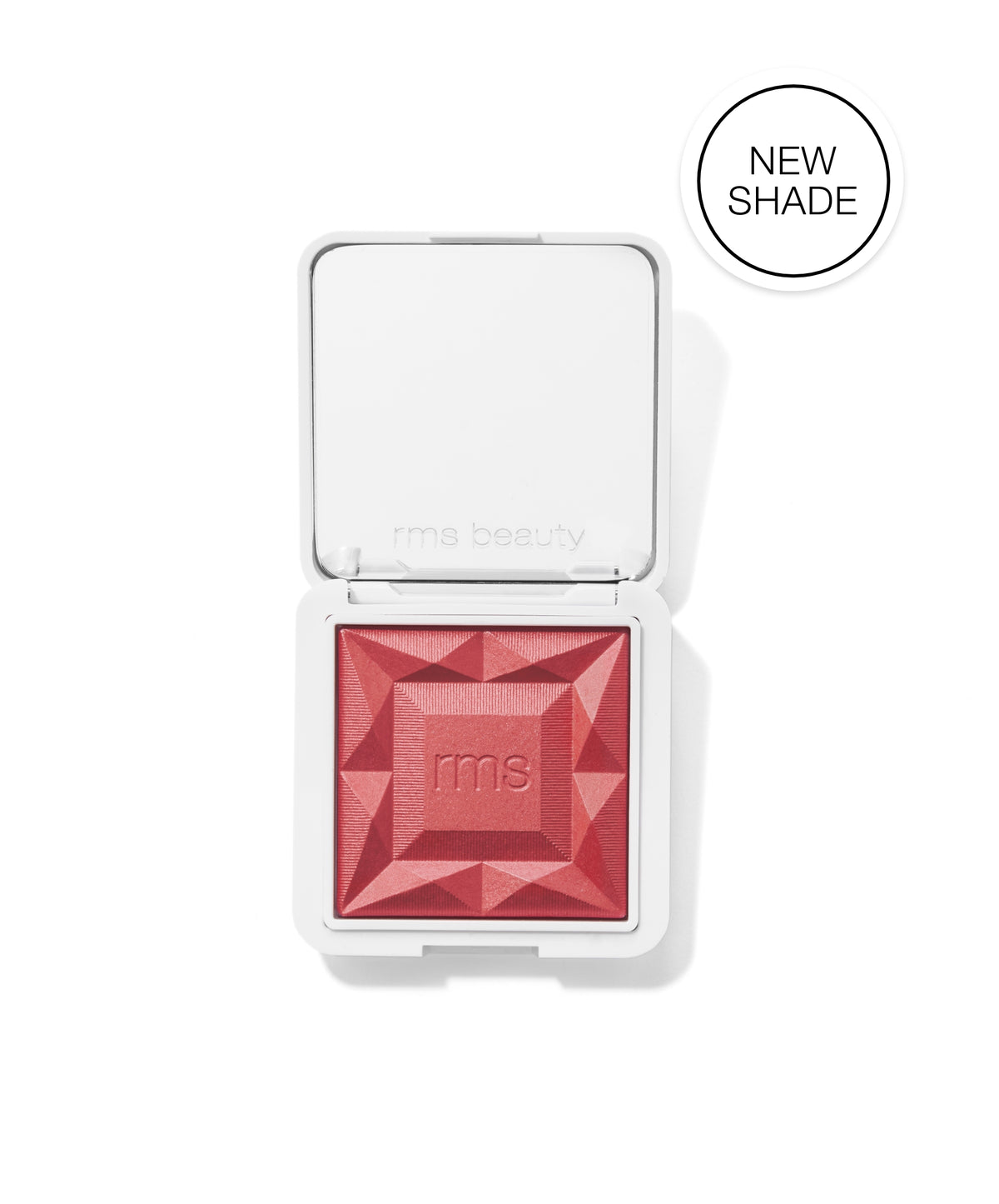 Open compact with a geometric patterned red blush featuring the embossed rms logo, showcasing the new shade of ReDimension Hydra Powder Blush by RMS Beauty