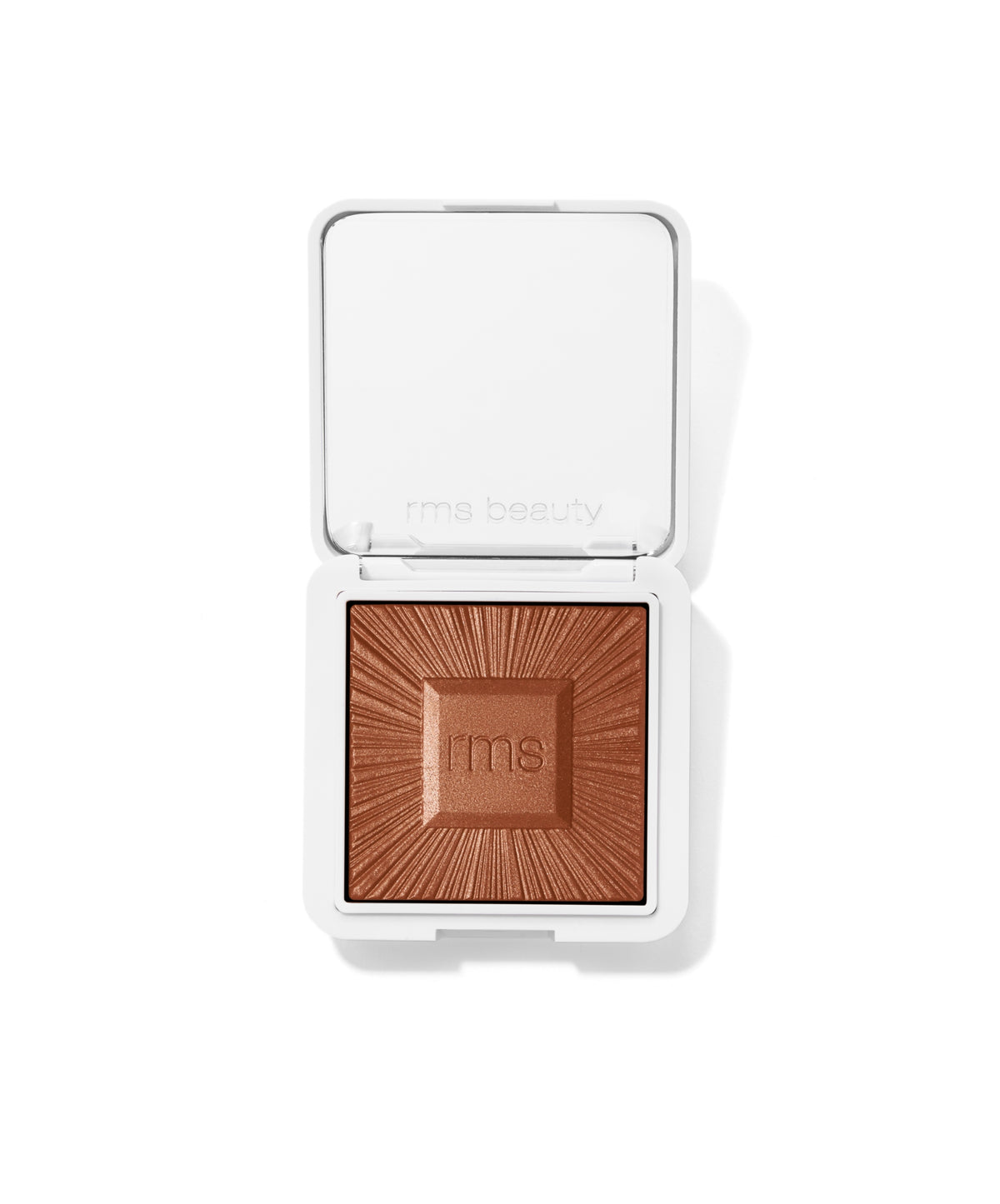 ReDimension Hydra Bronzer in sleek white compact with embossed sunburst pattern and rms logo, offering a natural bronzed glow with clean, cruelty-free beauty ingredients.