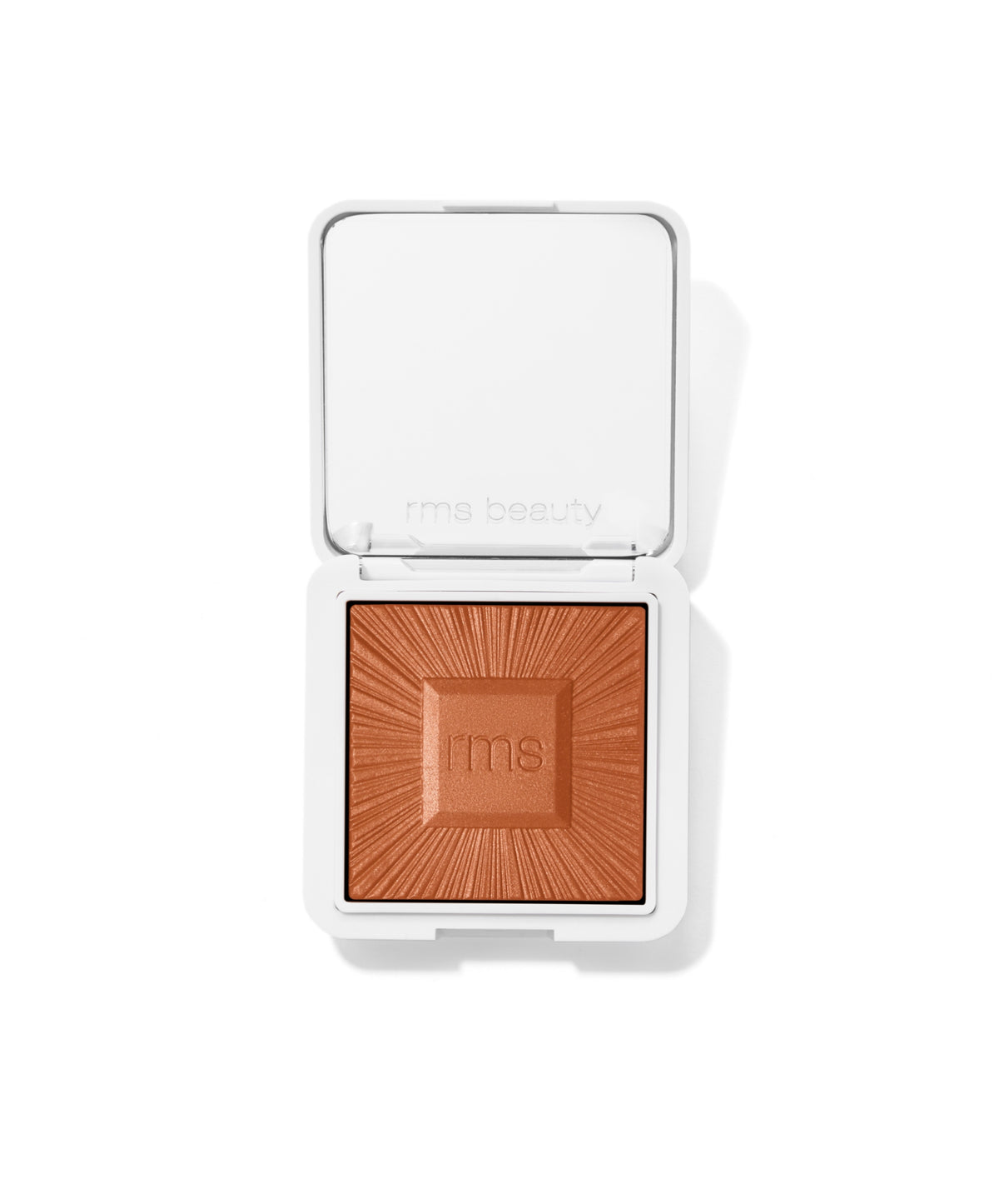 Open compact showing warm brown pressed powder bronzer embossed with "rms" in center, ReDimension Hydra Bronzer by RMS Beauty with clean beauty and natural ingredients.