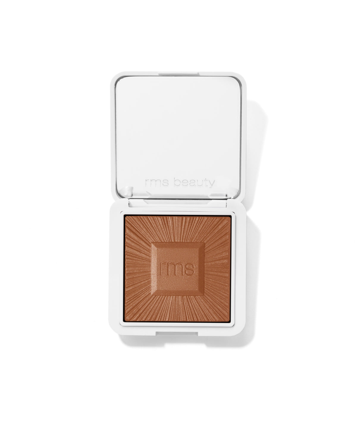 Open compact of ReDimension Hydra Bronzer featuring a smooth, sun-kissed brown powder embossed with radial lines and the "rms" logo, designed for natural, clean beauty makeup.