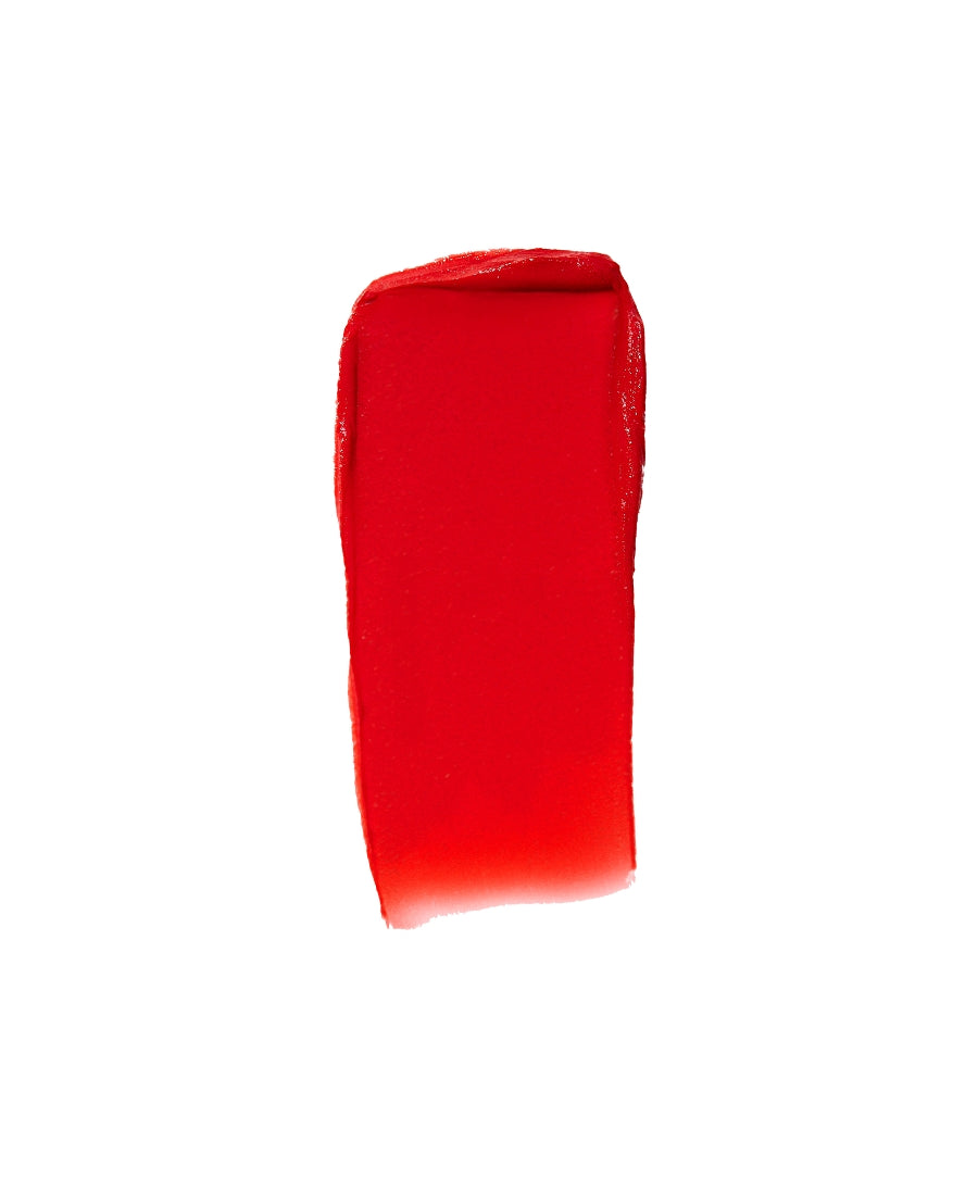 Swatch of vibrant red Lip2Cheek cream makeup showcasing its smooth, blendable texture and rich pigmentation for both lips and cheeks.