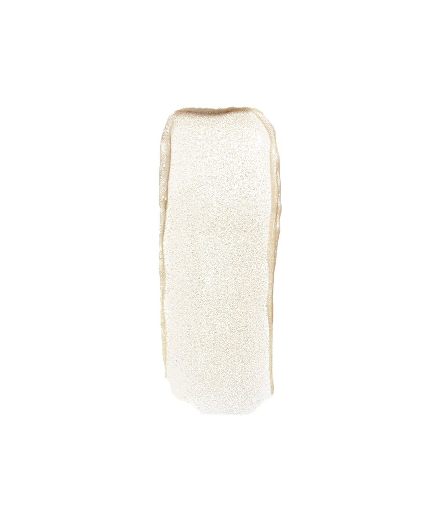 Swatch of Luminizer in a shimmering, pearl-toned shade showcasing a smooth, luminous texture with clean beauty qualities and natural ingredients.