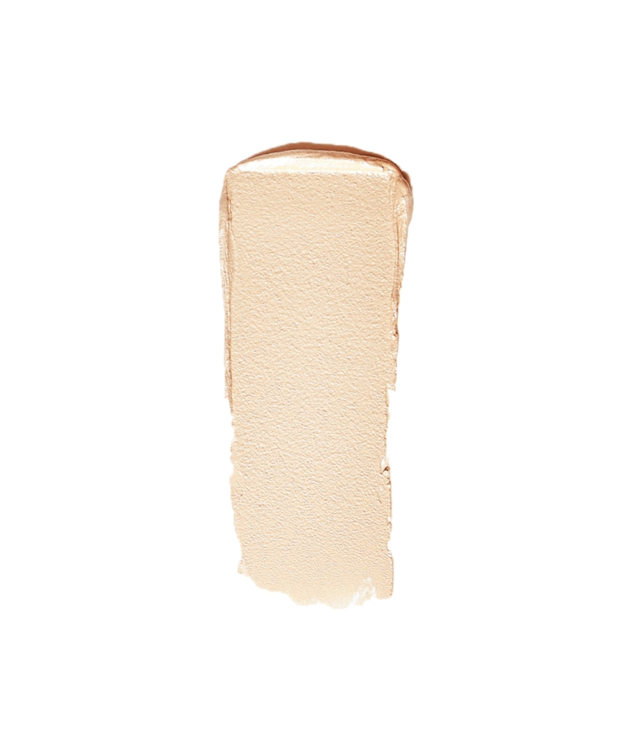 Creamy light beige swatch of Luminizer makeup showcasing smooth, natural finish with radiant glow and clean beauty ingredients for a subtle highlight effect.