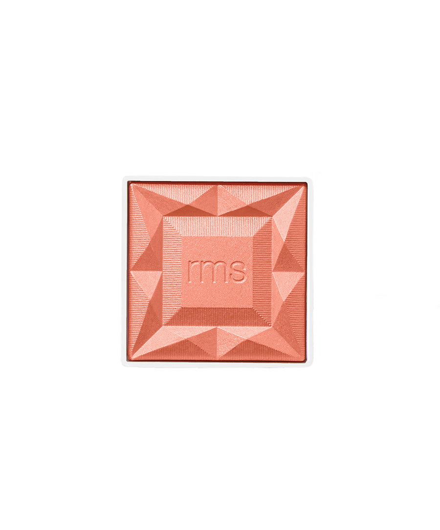 Square-shaped coral blush powder with geometric embossed design and "rms" logo in the center, representing ReDimension Hydra Powder Blush from RMS Beauty.