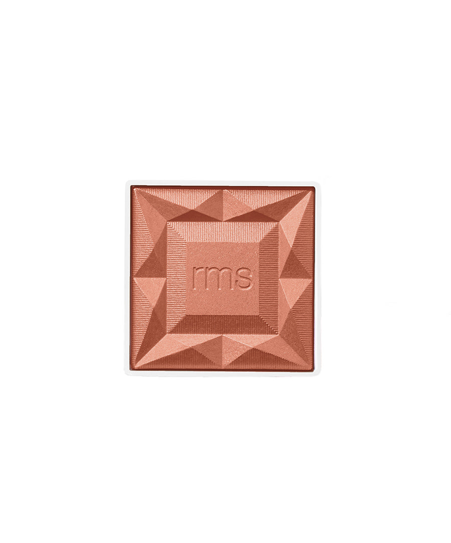 ReDimension Hydra Powder Blush in a warm, shimmering coral shade with a geometric embossed design featuring the rms logo, highlighting clean beauty and sustainable packaging.
