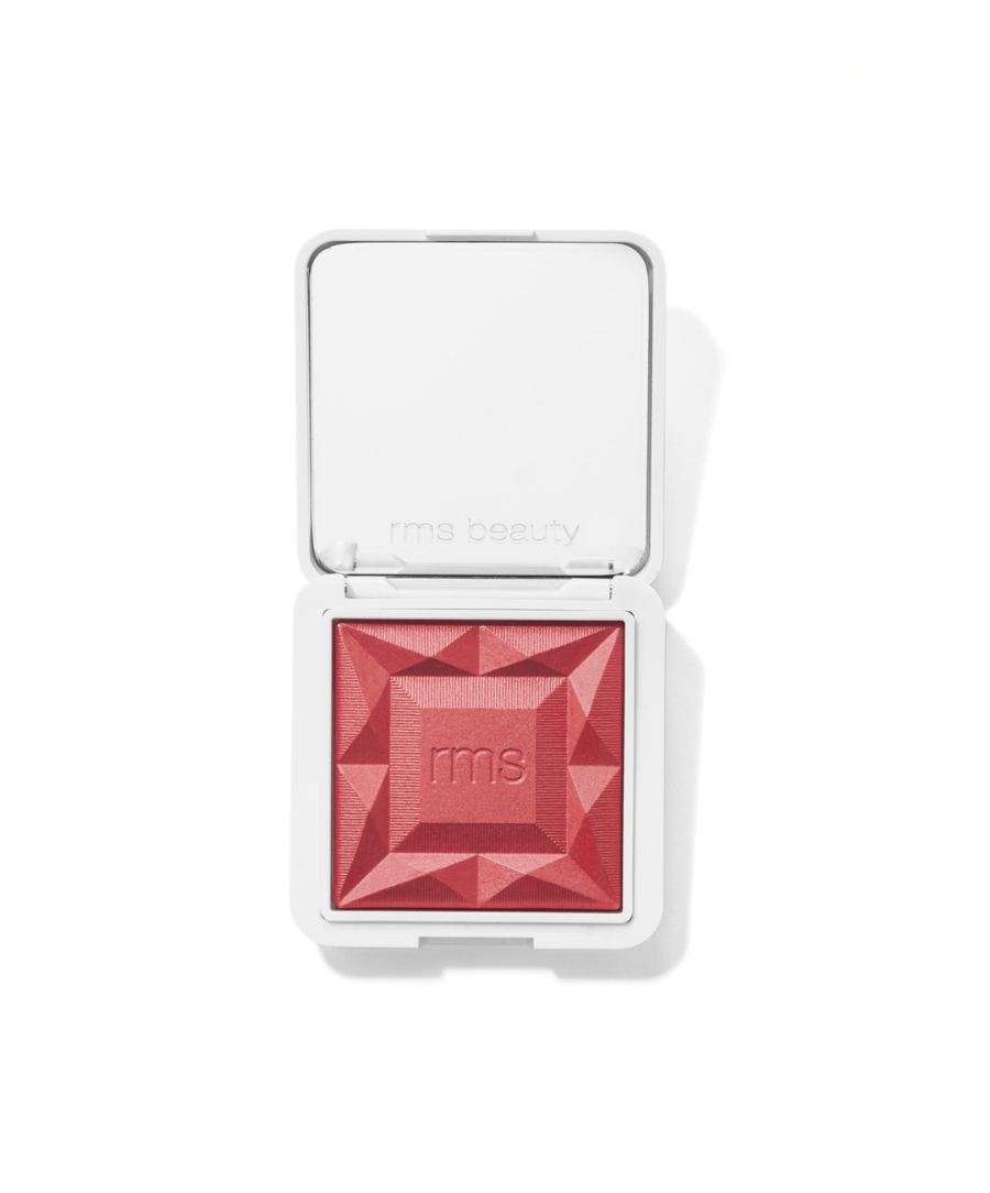 ReDimension Hydra Powder Blush in vibrant coral pink with a geometric embossed pattern, housed in a sleek white compact, featuring clean beauty and natural ingredients.