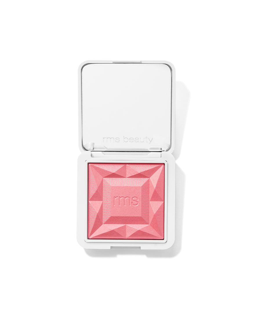 Open compact of ReDimension Hydra Powder Blush in a soft pink shade with a geometric embossed design, featuring recyclable packaging and clean beauty ingredients.