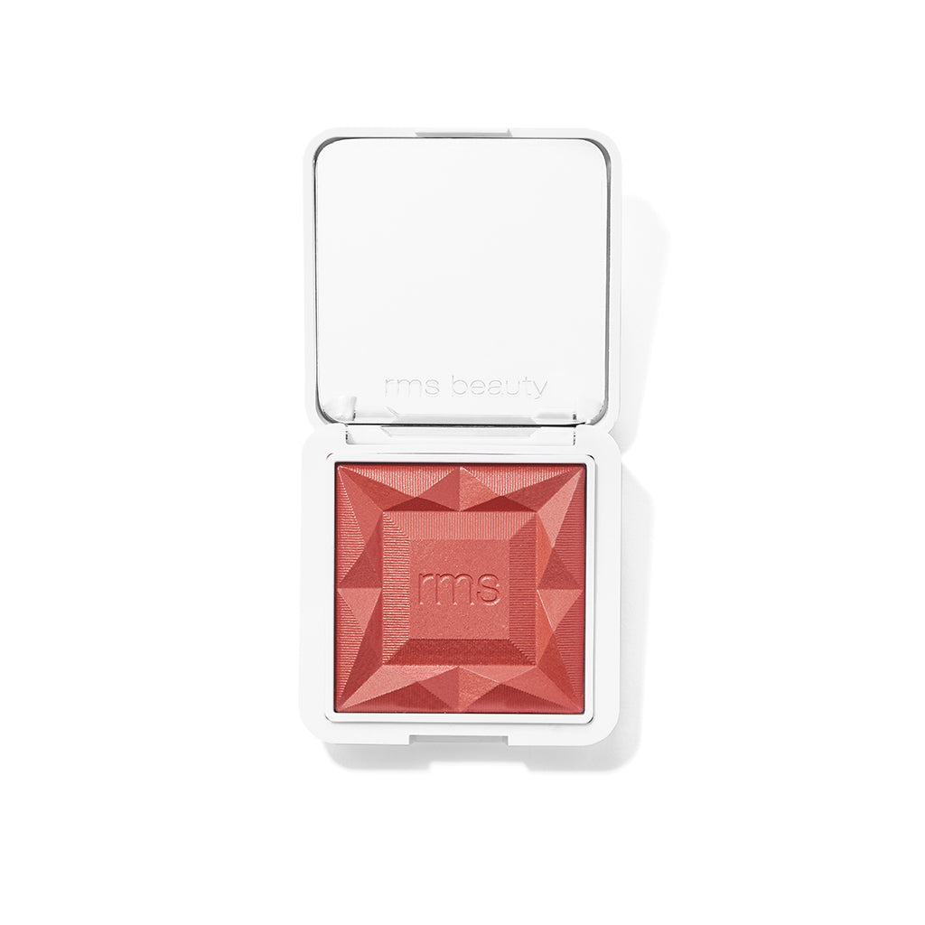 ReDimension Hydra Powder Blush in a compact with a geometric embossed design featuring a rich, warm berry shade, highlighting clean beauty and natural ingredients.