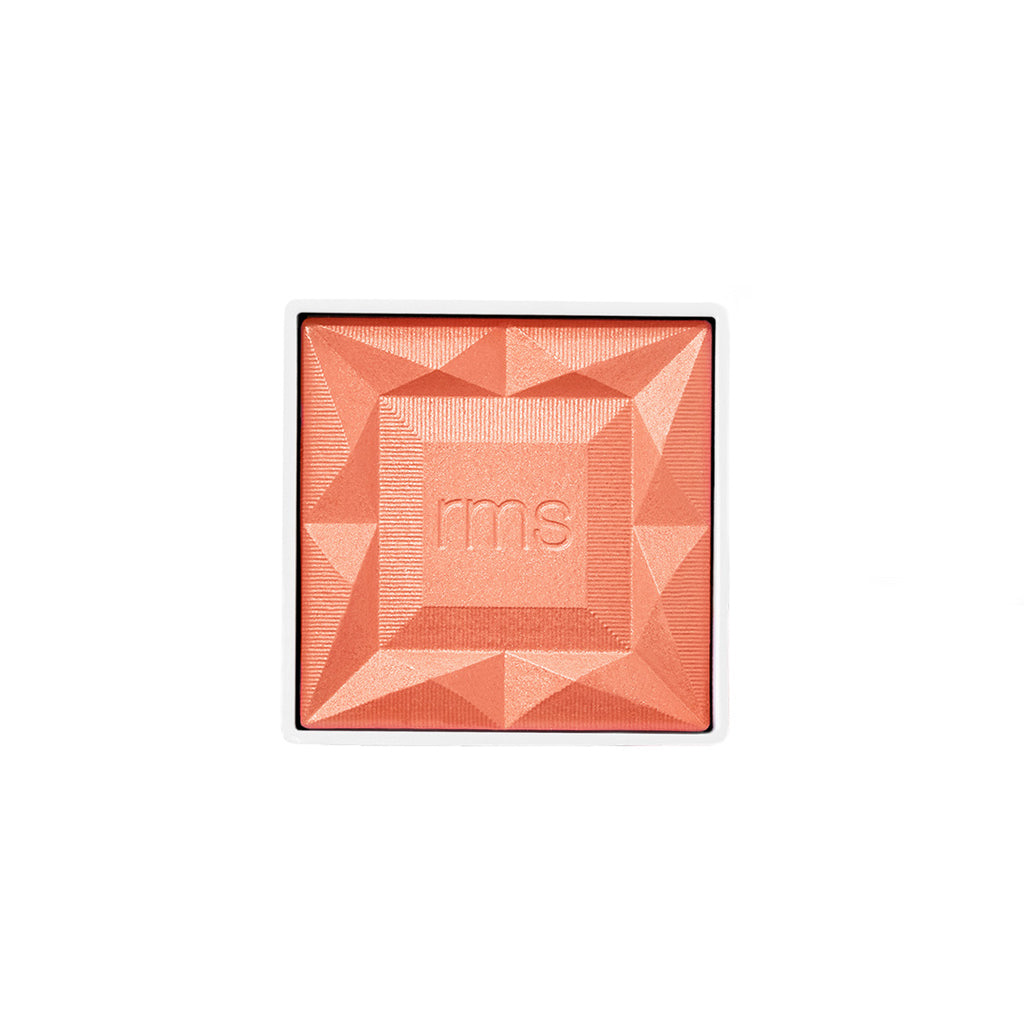 ReDimension Hydra Powder Blush in a warm coral shade with a geometric embossed design and rms branding, highlighting clean beauty and natural ingredients.