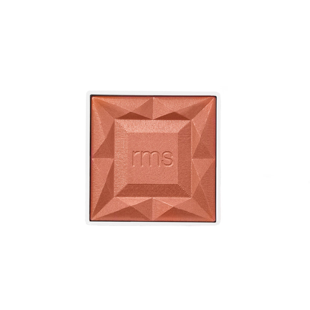 Square compact refill of ReDimension Hydra Powder Blush in a warm coral shade with embossed geometric design and rms branding, featuring clean beauty and natural ingredients.