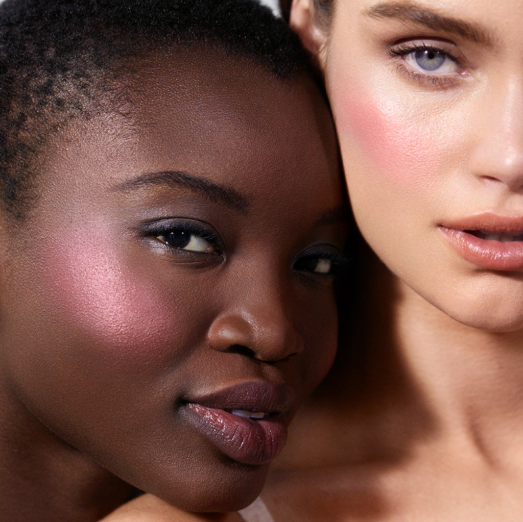 Close-up of two women with glowing skin wearing pink cheek color from ReDimension Hydra Powder Blush, showcasing natural ingredients and clean beauty makeup look.