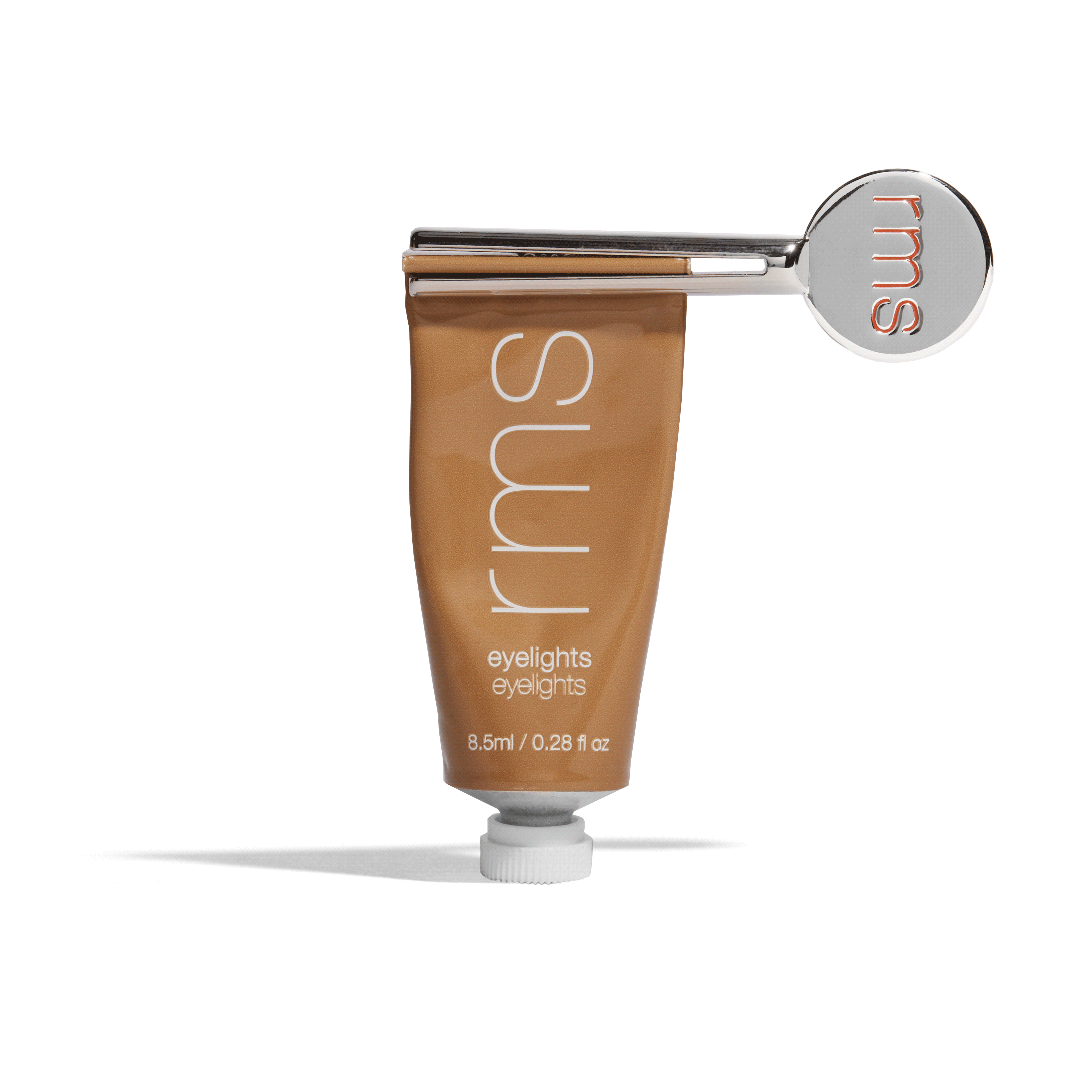 GIF of RMS Reusable Metal Tube Key  twisting slowly to dispense Eyelights Cream Eyeshadow