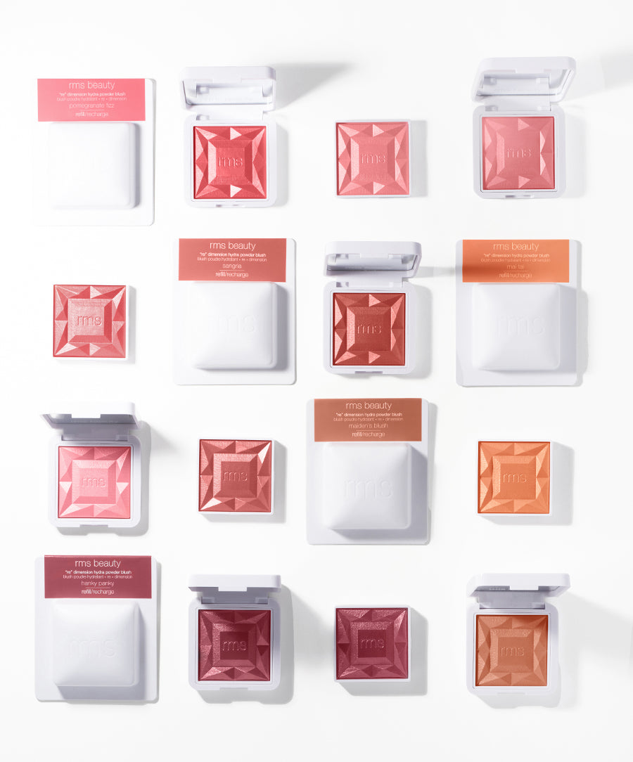 Assortment of ReDimension Hydra Powder Blush in various shades displayed with both open and closed compact cases, showcasing the product’s clean beauty and sustainable packaging.