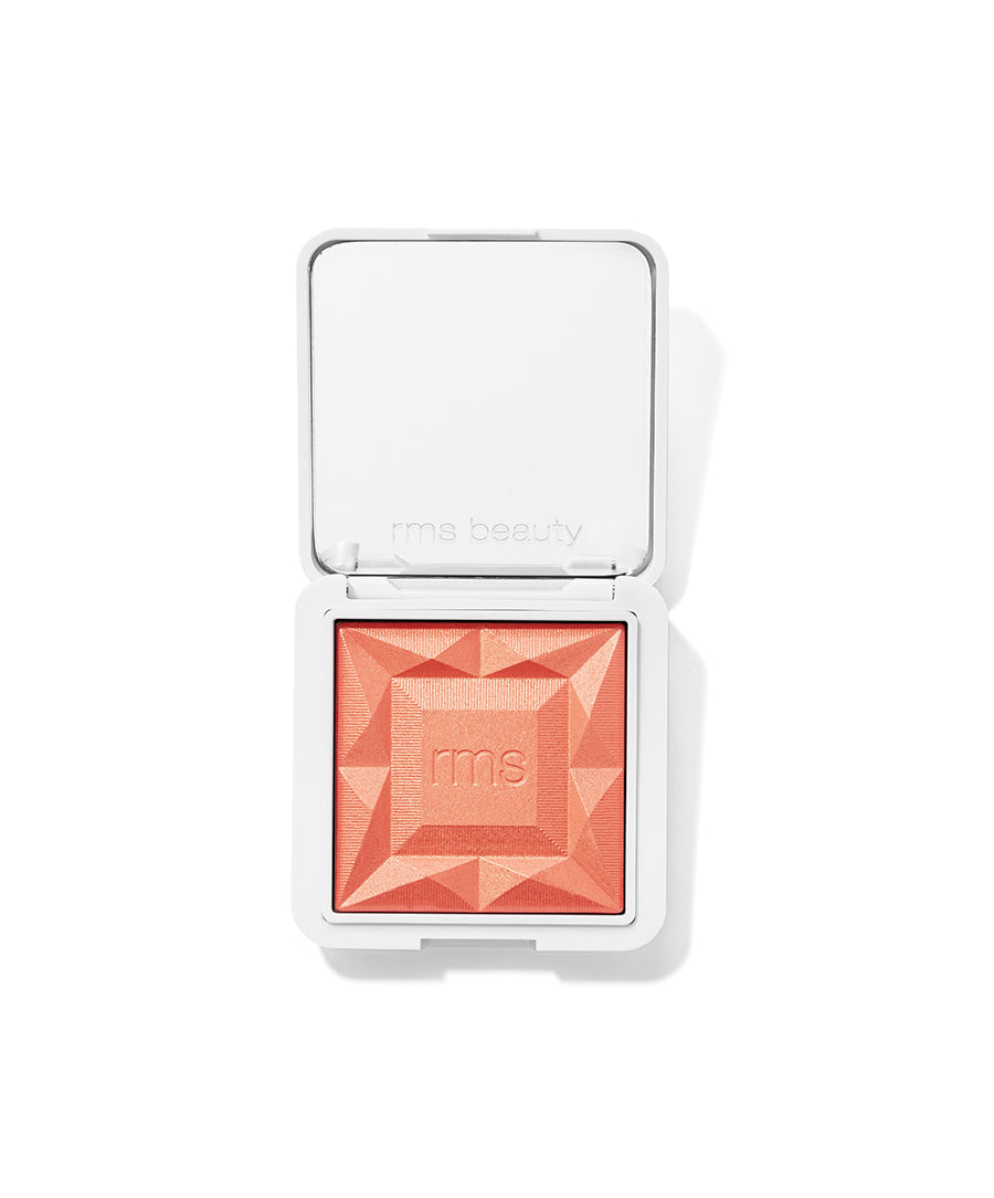 ReDimension Hydra Powder Blush in a coral shade with geometric embossed design, housed in a sleek white compact reflecting clean beauty and sustainable packaging.