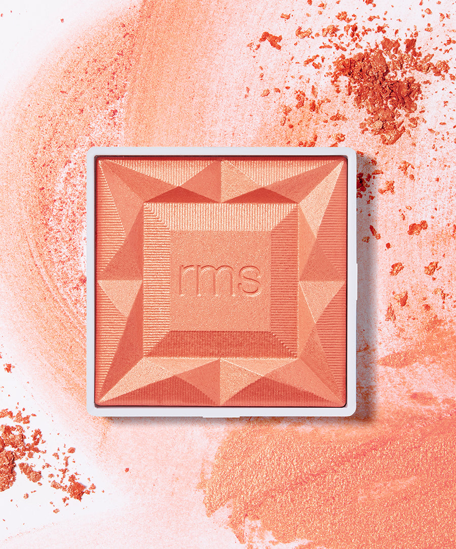 ReDimension Hydra Powder Blush in a warm coral shade with geometric embossed design, made with natural ingredients, cruelty free makeup, and sustainable packaging.