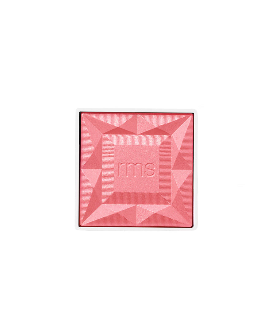 ReDimension Hydra Powder Blush in a coral-pink shade with a geometric embossed pattern and rms logo, showcasing clean beauty and sustainable packaging attributes.